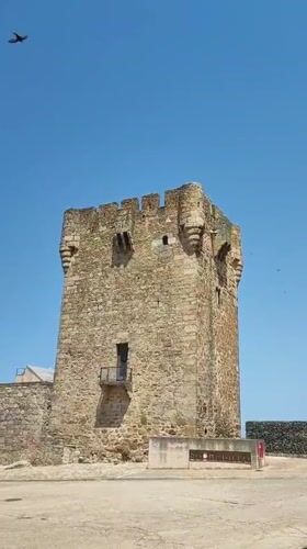 Sobradillo's medieval tower, festival square, and oleander in bloom