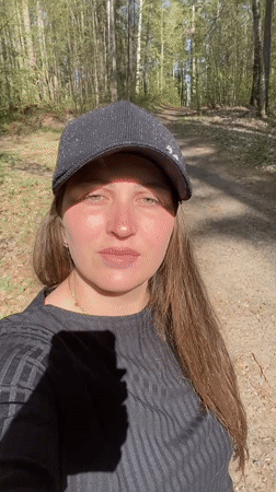 Woman photographed in wooded area in Noviy, Russia