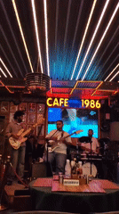 Live band night at a Manali bar, streets active outside