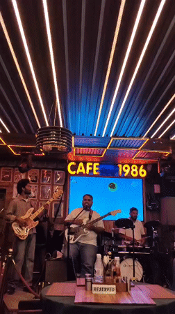 Live band night at a Manali bar, streets active outside