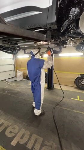 Automotive maintenance and parking activities observed in Izhevsk