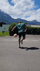Man practices soccer juggling on road in Altdorf