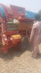 Morning farm work captured around threshing machine in Pakistan