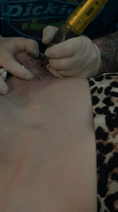 Tattoo artist creates sun designs during session in Varna