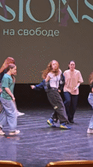 Six young dancers perform on stage in casual attire