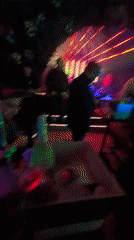Nightclub scene captured in Belgrade with patrons and disco lighting