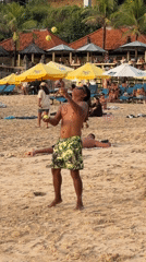 Beach juggling and newlywed photos captured during Kuta sunrise