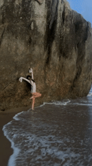 Woman practices yoga poses on Ahungalla beach, Sri Lanka