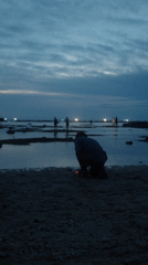Photographers gather at Vietnam beach during twilight hours