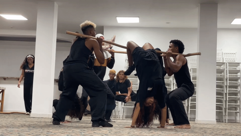 Dance group rehearses acrobatic and stick routines in Porlamar studio