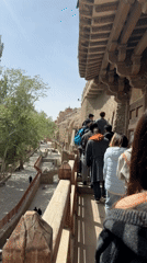 Early morning tourist activity at Mogao Caves in Dunhuang