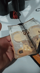 Euro banknotes manipulated, cut during evening demonstration session