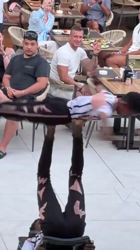 Acrobats perform dinner show at Alanya restaurant during sunset