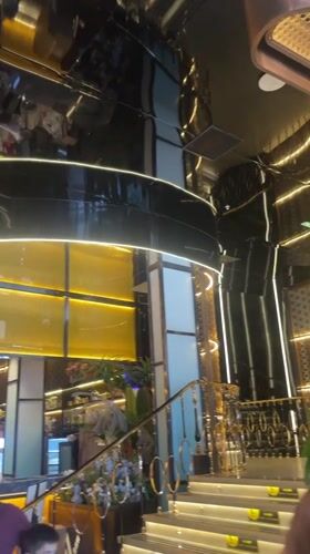 Inside a sleek, ornate Barcelona venue with dramatic gold and black interiors.