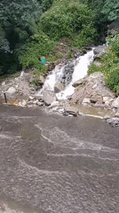 Flooded roads and moving vehicles near Manali amid heavy rain