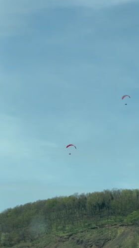 Paragliders spotted over hills near Niederzissen, Germany