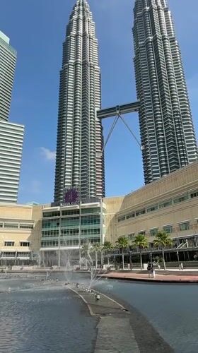 Early morning tourist activity at KLCC fountain, Kuala Lumpur