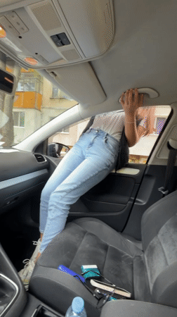 Woman moves around inside parked car in Gabrovo Bulgaria