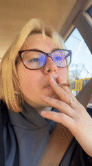 Woman smoking in passenger seat captured in Odesa vehicle