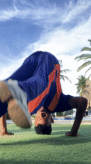 Man performs calisthenics workout on Porlamar lawn