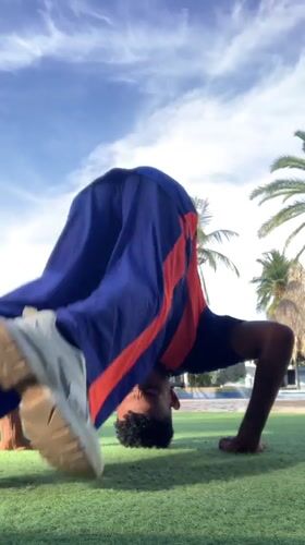 Man performs calisthenics workout on Porlamar lawn