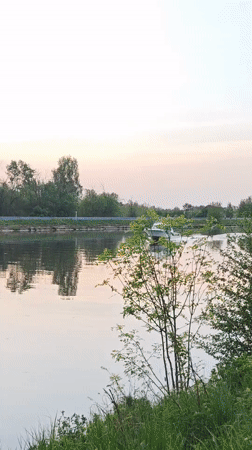 Evening river traffic observed during sunset in Dmitrov