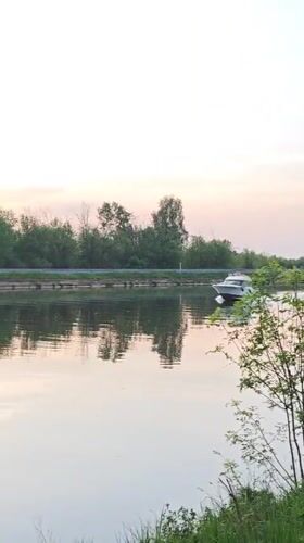 Evening river traffic observed during sunset in Dmitrov