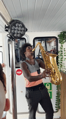 Saxophonist entertains costumed crowd at Barcelona boat party