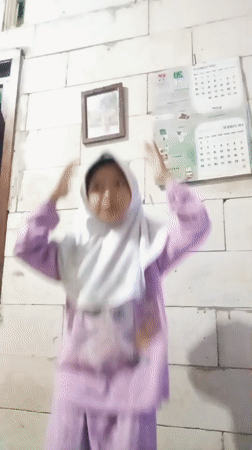 Child's playful photo session captured in Baron, Indonesia home