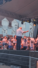 Brass ensemble performs under tented stage in Hévíz