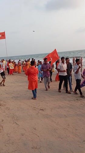 Orange flag procession draws crowds to Arambol beach