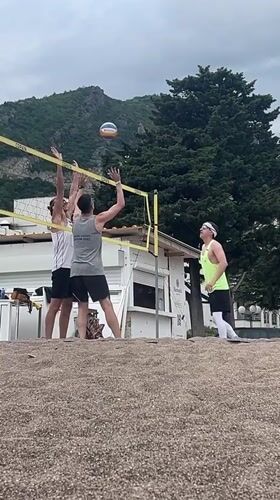 Early morning beach gathering in Boreti, Montenegro draws volleyball players