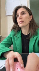Woman works at desk in Kaspiysk school setting