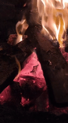 Nighttime cafe gathering with bonfires documented in Da Lat Vietnam