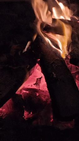 Nighttime cafe gathering with bonfires documented in Da Lat Vietnam