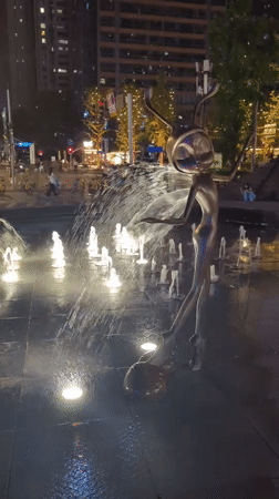 Wuhou square at night: alien statues, panda screens, glowing towers