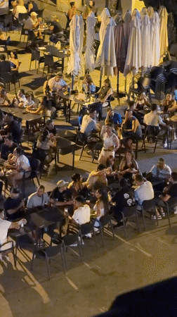 Summer evening on a busy Las Rozas plaza terrace