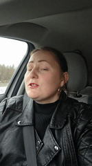Woman in black leather jacket observed in car, Chaikovsky
