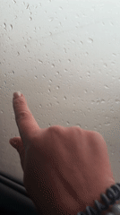 Person draws heart in window condensation in Perm