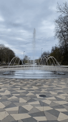 Person runs through fountain in Kingisepp park