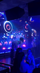 Nightclub scene with dancers and crowds in Sofia