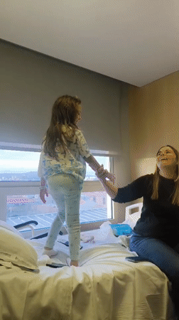 Girl in pajamas dances, comforts woman in Sabadell hospital