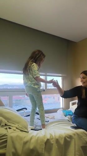 Girl in pajamas dances, comforts woman in Sabadell hospital