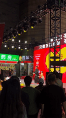 Father-daughter duo performs on outdoor stage in Jiulongpo District