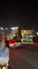 Street traffic and dining moments captured in Lhokseumawe