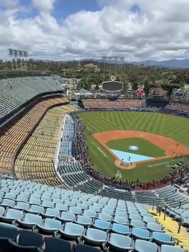Baseball game in progress at Dodger Stadium with crowds