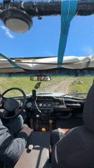 Driver navigates dirt road in convertible near Teghut, Armenia