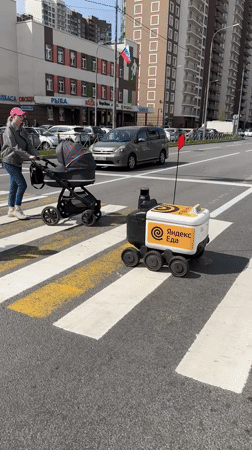 Delivery robots navigate crosswalks in Murino, Russia