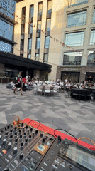 Casual outdoor DJ event observed in Kazan amid modern architecture