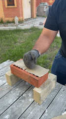 Man works with materials at outdoor table in Krasnoyarsk
